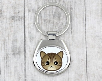 A key pendant with Dragon Li cat. A new collection with the cute Art-dog cat