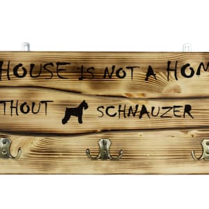 Schnauzer, a wooden wall peg, hanger with the picture of a dog and the words: &quot;A house is not a home without...&quot;