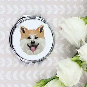 A pocket mirror with a Akita Inu dog. A new collection with the geometric dog