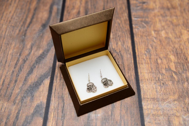 Silver-plated earrings with an image of a pure-bred dog Poodle