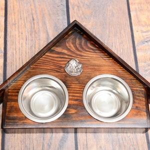 A dog’s bowls with a relief from ARTDOG collection - Newfoundland.