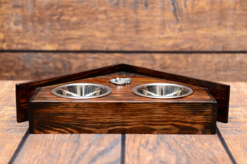 A dog\u2019s bowls with a relief from ARTDOG collection Papillon