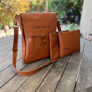 May include: A rustic wooden sign with the text "Welcome to our home" in white lettering. The sign features a distressed finish and a simple, inviting design, perfect for a front porch or entryway.