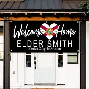 a sign welcoming Elder Smith to Florida, with the text "Welcome Home Elder Smith Florida Orlando Mission" displayed prominently.