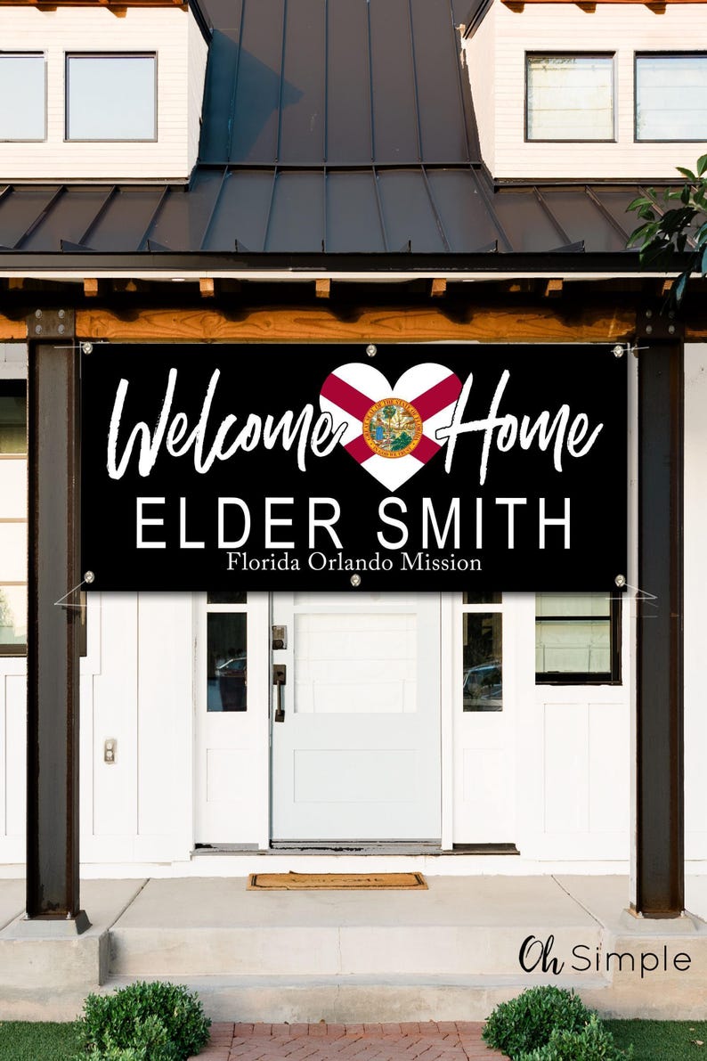 a sign welcoming Elder Smith to Florida, with the text "Welcome Home Elder Smith Florida Orlando Mission" displayed prominently.