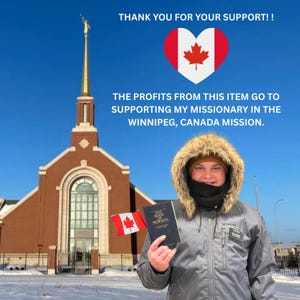 A person holding a book and wearing a fur-lined hooded jacket stands in front of a red brick church with a golden spire, holding a Canadian flag.