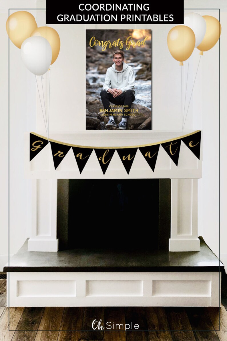 May include: Black and gold graduation banner with the word "graduate" in gold lettering. A black and gold sign with the text "Congrats Grad" and a photo of a graduate. The sign is hanging above a fireplace.
