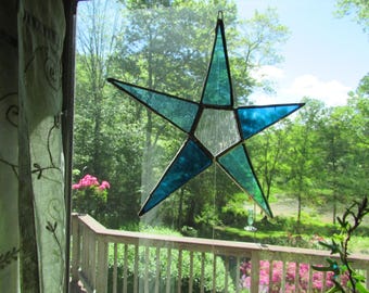 Stained glass star in shades of blue.
