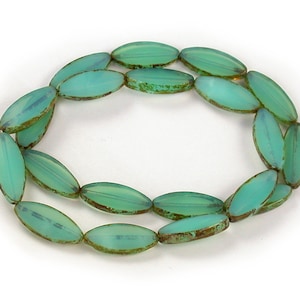 Medium UV active Blue Green opaline w/ picasso finish 21 x 8mm oval spindle beads. Set of 10.