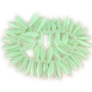 Crystal transparent Mint Green UV Active opaque medium size 16 x 5mm daggers. Set of 25, 50 or 100.