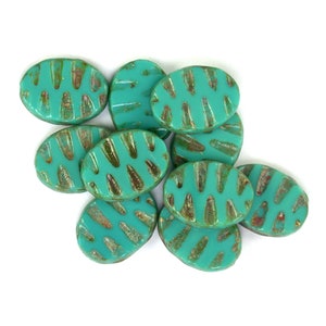 Turquoise Blue opaque w/ Brown picasso 11 x 15 x 3mm carved oval. Set of 10.