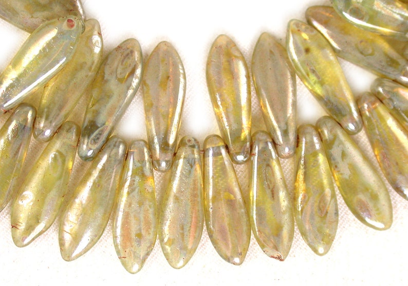 Set of 25 or 50. Pale Yellow Green transparent w Light Gold luster 16 x 4mm daggers