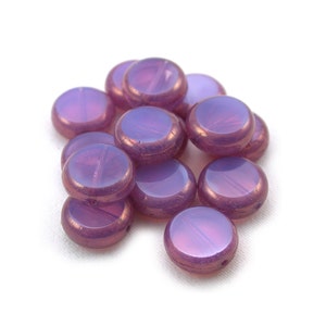 Rosa lila opalglas med bronsmynt på 11 mm. Set om 7 eller 15.