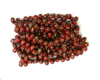 Red opaque w/ Brown picasso small 4 x 6mm drops. Set of 50.