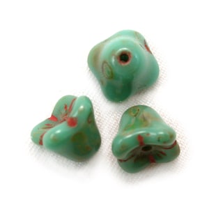 Turquoise Green opaque w/ Red details, picasso 6 x 9mm four point bell flowers. Set of 25.