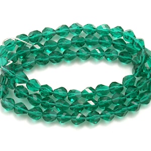 Emerald Green transparent 7mm nugget cut faceted firepolished rounds. Set of 12 or 25.