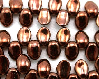 May include: A strand of copper-colored glass beads with a slightly irregular, oval shape. The beads have a metallic sheen and are strung together on a clear thread.
