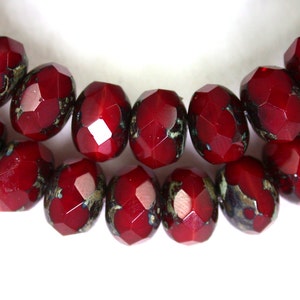 Deep Red opaline w/ picasso 6 x 9mm rondelles. Set of 12 or 25.