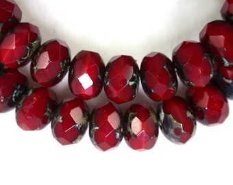 Deep Red opaline w/ picasso 6 x 9mm rondelles. Set of 12, 25 or 50.