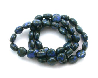 Blue silk opaque w/ picasso 10mm lentil beads. Set of 15.