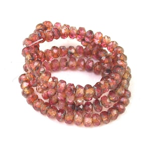 Crystal transparent Fuchsia mix w/ Golden Brown picasso 3 x 5mm rondelles. Set of 30.