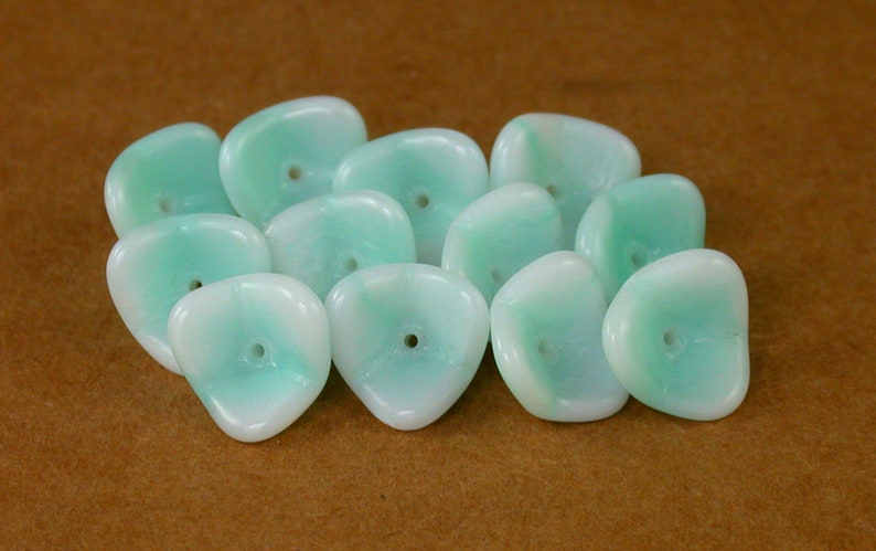 25 50 or 75. Set of 12 White w UV Active Light Mint Green glaze 12 x 9mm three sided flowers