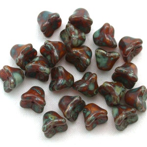 Reddish Brown opaline w/ picasso 6 x 9mm four point bell flowers. Set of 25.