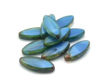 Blue silk w/ picasso finish 18 x 7mm oval spindle beads. Set of 10.