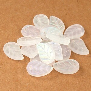 Crystal matte w/ light AB 10 x 15 x 4mm curved flat leaves. Set of 12 or 25.