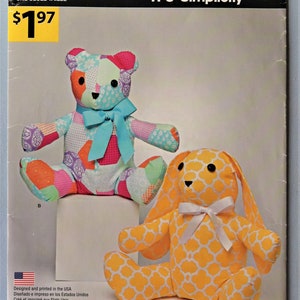 May include: A Simplicity sewing pattern envelope A1191 featuring a patchwork teddy bear with a blue ribbon and a yellow and white quatrefoil patterned rabbit with a white ribbon. The text reads IT'S SO EASY and IT'S Simplicity with product details.