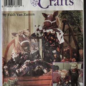 May include: Simplicity Crafts pattern 8266 by Faith Van Zanten for sewing stuffed horse dolls. The envelope features illustrations of four horse dolls in various outfits, including dresses and overalls, with yarn manes and fabric bridles.