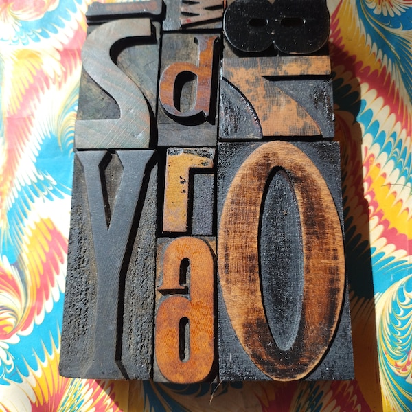Group of old letterpress printing blocks, size of group is 6" x 4".