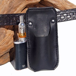 May include: A black leather belt holster with a black and silver electronic cigarette inside. The holster has a stitched edge and a snap closure. The cigarette has a silver mouthpiece and a clear tank. The text "iStick 30W" is printed on the side of the cigarette.