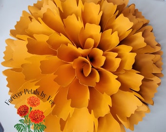 May include: A large, bright yellow paper flower with a layered, ruffled design. The flower is made of multiple paper petals and has a circular shape. The text "Forever Petals by Vee" is visible on the bottom left corner of the image. The text "Paper Florist" is visible on the bottom center of the image.
