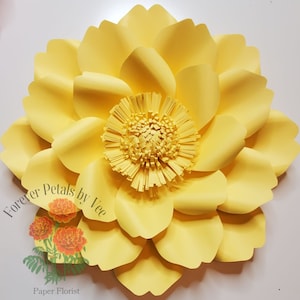 May include: A large, handcrafted paper flower in shades of yellow. The flower features multiple layers of petals surrounding a detailed center. The image includes the text "Forever Petals by Vee" and "Paper Florist".