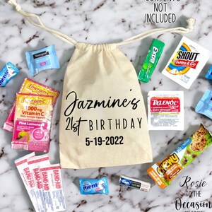 May include: A white canvas bag with the text "Jazmine's 21st Birthday 5-19-2022" printed on it. The bag is filled with various small items, including sweets, chewing gum, and medicine.