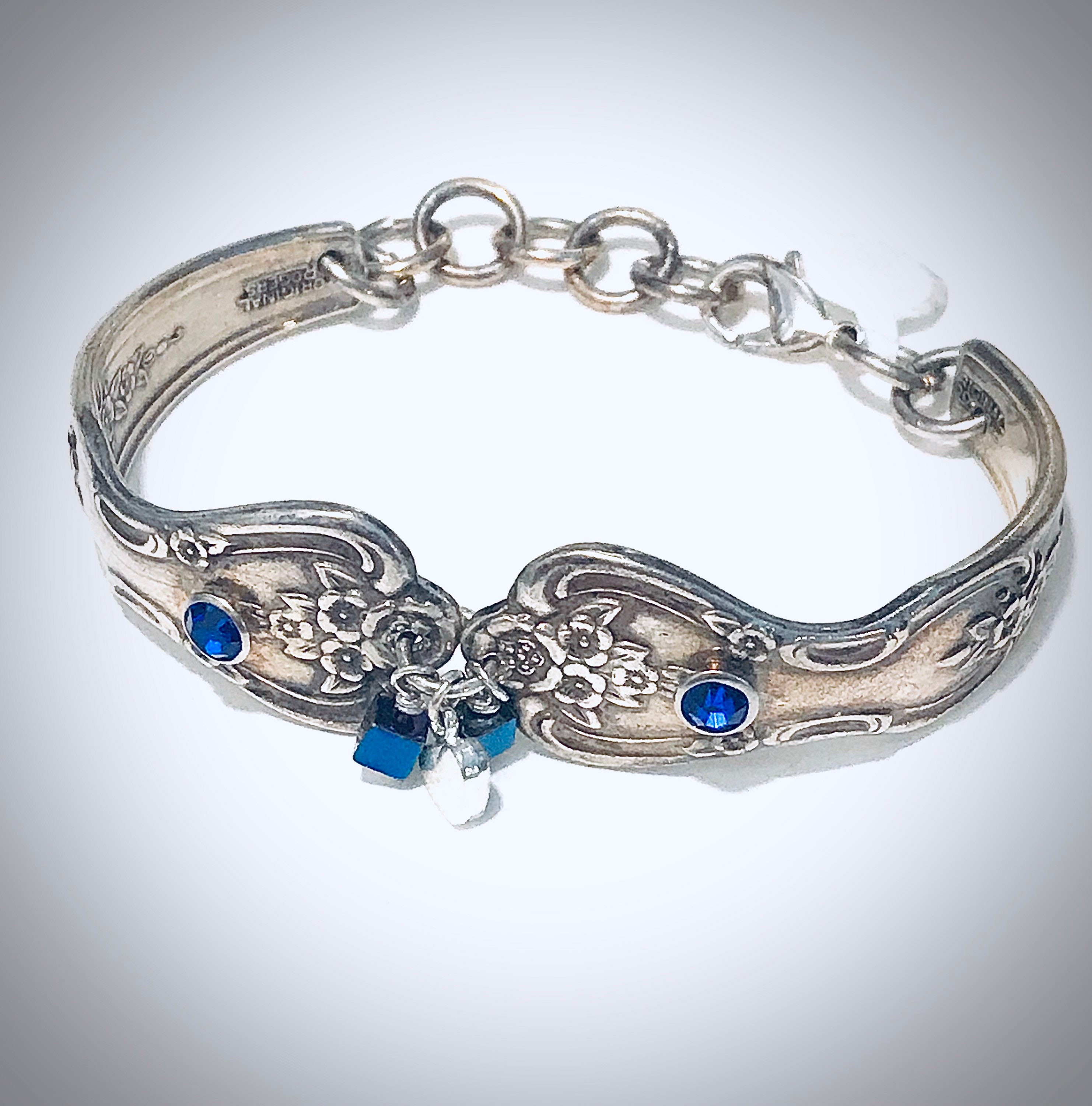 Vintage silverware bracelet with inserted blue CD stones and miniature