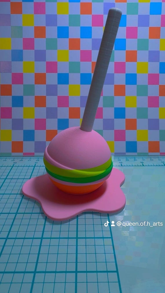 Melting lollipop sculpture | melting pop art | melting lollipop | pop art | lollipop ring holder | ring holder | striped lollipop