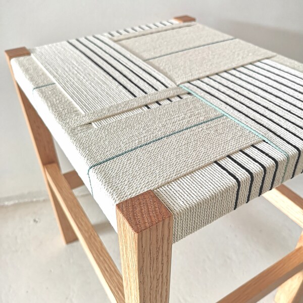 Low stool. Handmade with wood and cotton rope. Textile design, with stringed seat. Kai Model