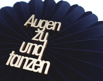 Close your eyes and dance. Decorative wooden lettering.