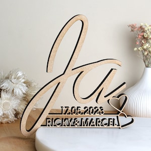 Sim, com letras decorativas de madeira com nome e data