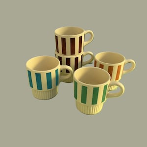May include: A collection of ceramic mugs with vertical striped designs in various colors, including teal, brown, orange, and green. The mugs have a cream-colored base and handles. The mugs are stacked and arranged on a neutral background.