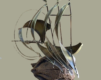 Large masted copper ship on a burl art piece