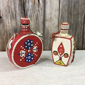 2 leather covered flask/liquor bottles