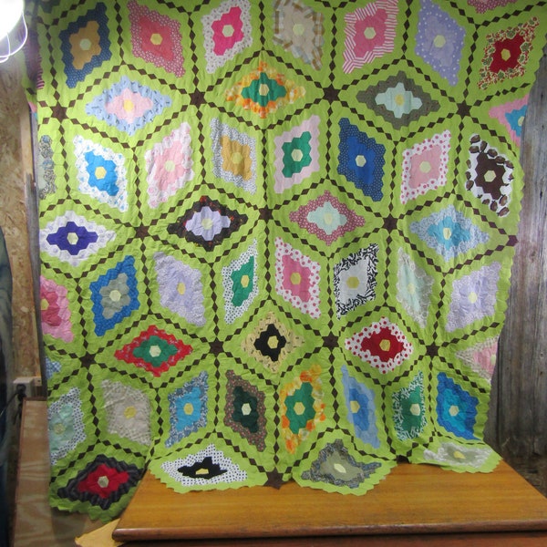 Grandma's garden quilt top with green background