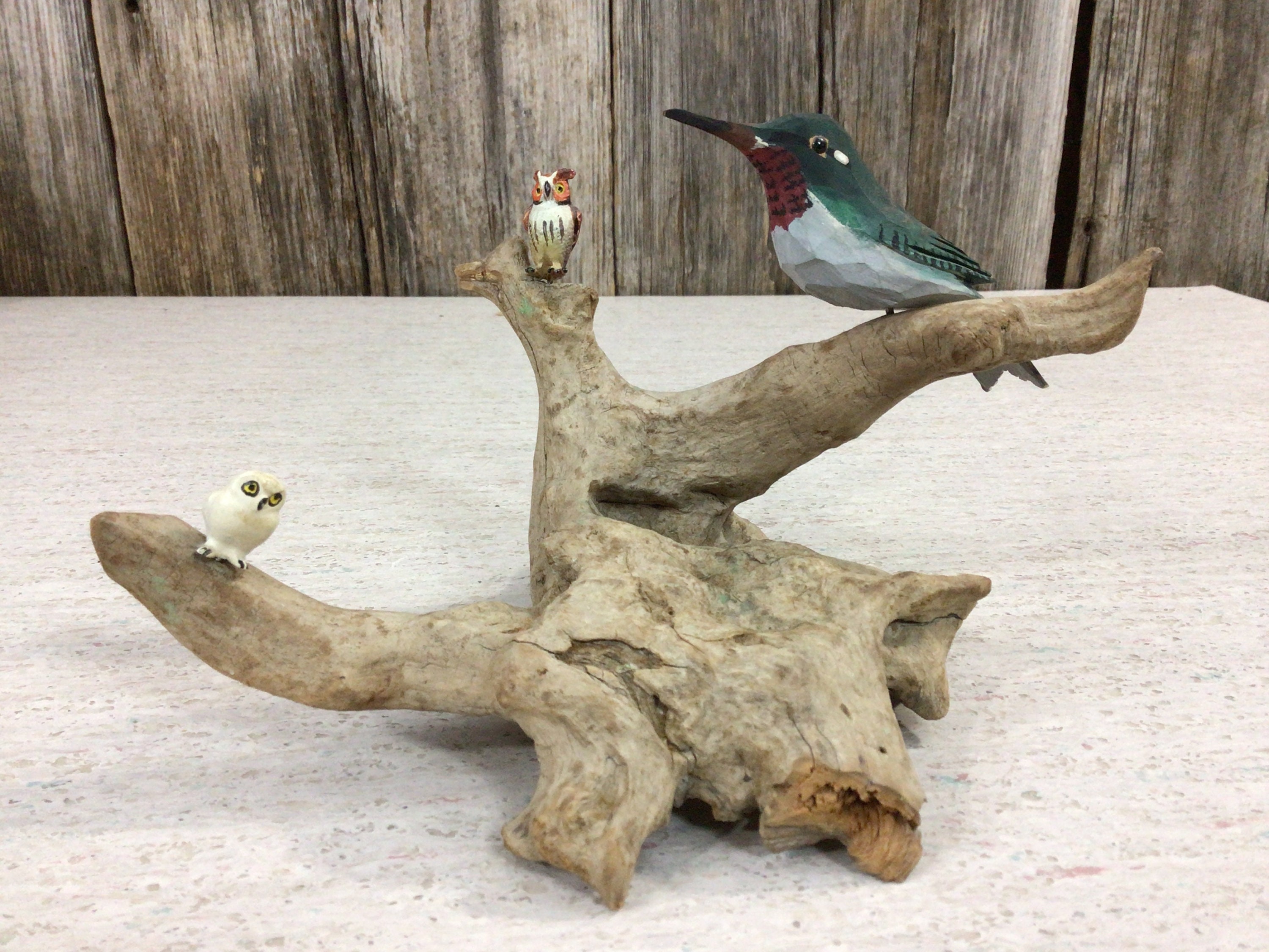 Vintage carved bird and owls on natural root