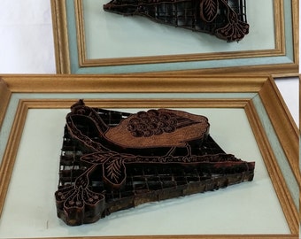 Pair of framed vintage copper batik fabric stamps with birds