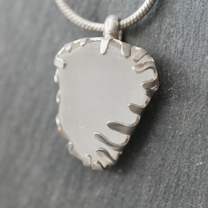 White sea glass and sterling silver pendant