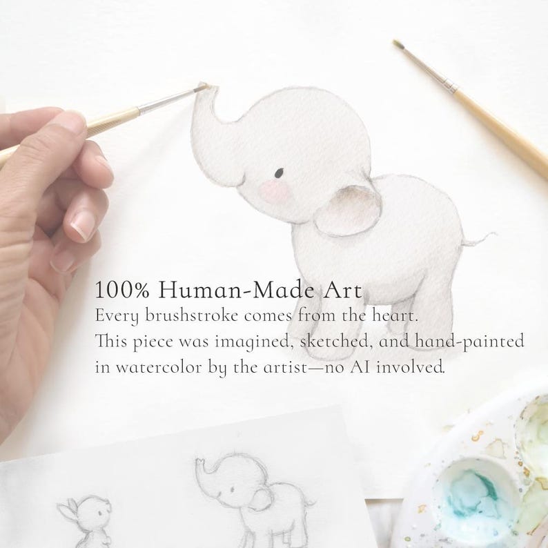 May include: A watercolor illustration of a light gray elephant with pink cheeks on white paper. The text reads: 100% Human-Made Art. Every brushstroke comes from the heart. This piece was imagined, sketched, and hand-painted in watercolor by the artist&mdash;no AI involved.