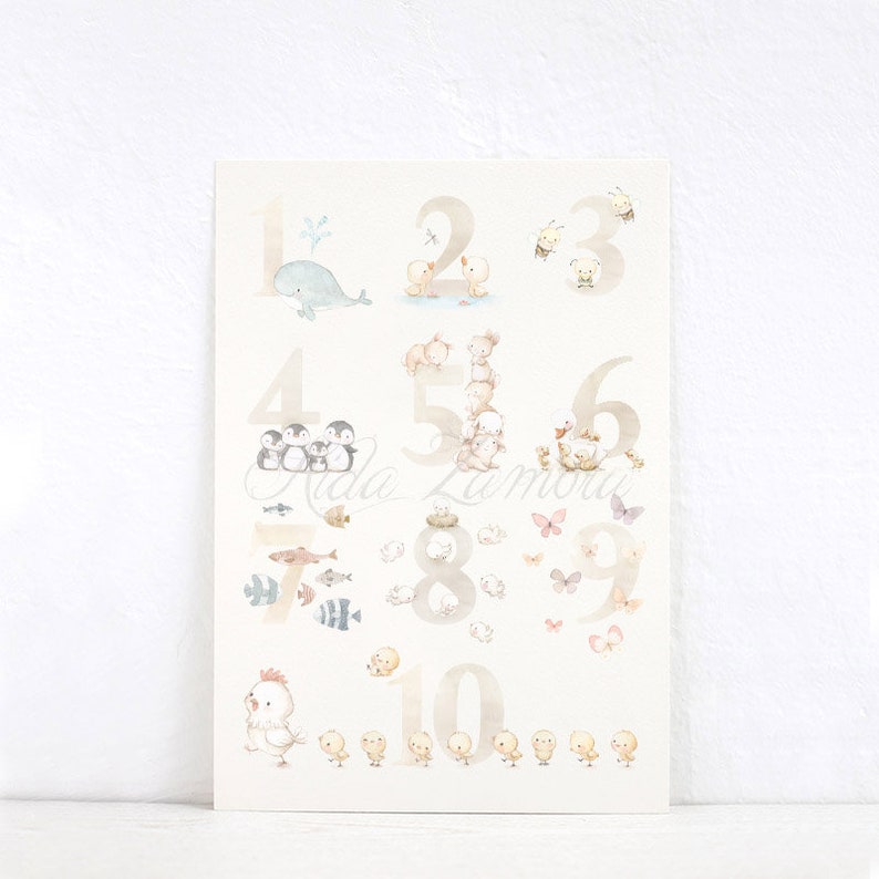 May include: A watercolor illustration of numbers 1 through 10 with various animals. The numbers are in a light brown color and the animals are in shades of blue, brown, gray, and yellow. The animals include a whale, ducks, bees, penguins, bears, fish, butterflies, and chicks.